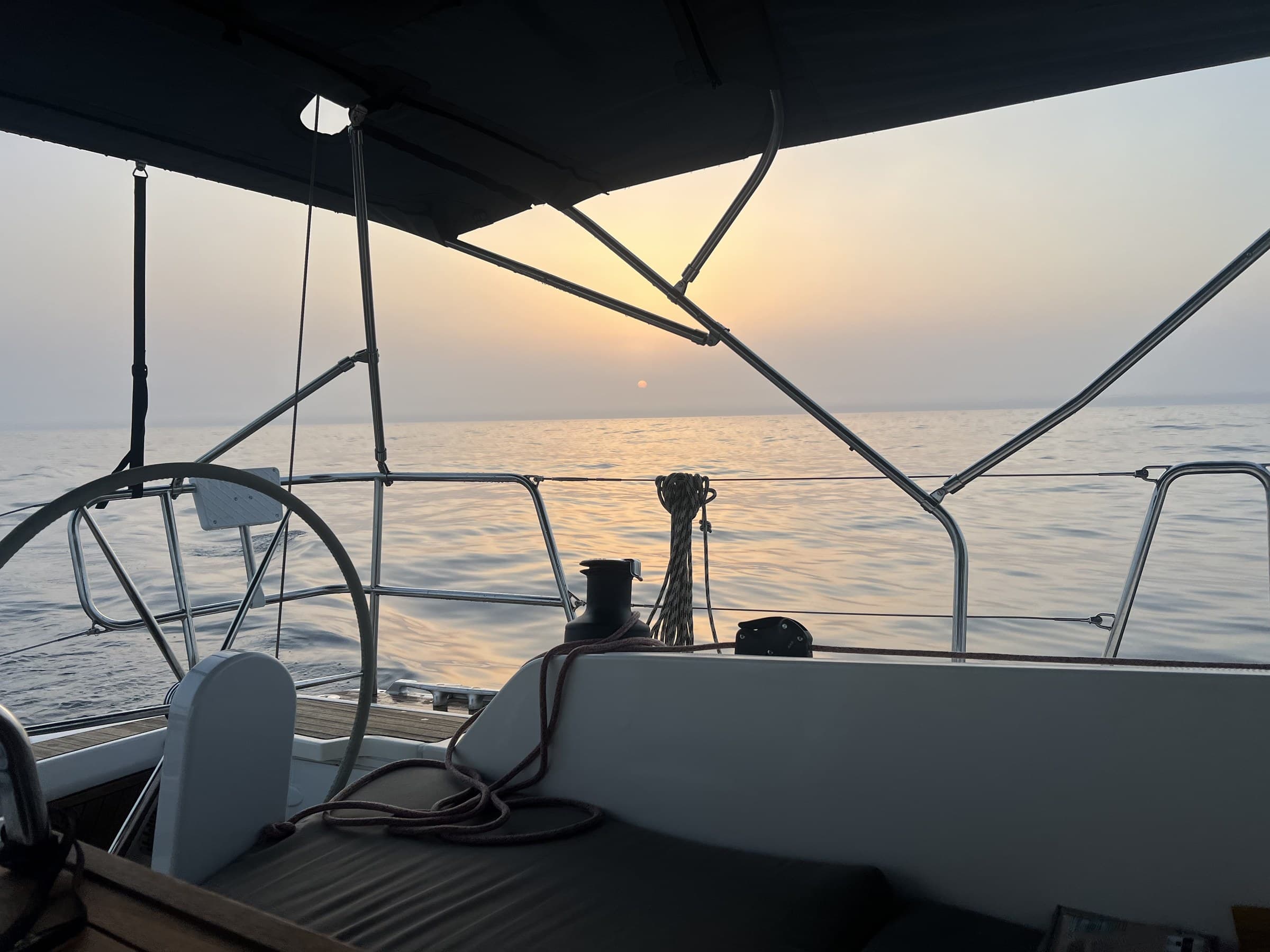 View from the cockpit of the Bavaria 42 at golden hour